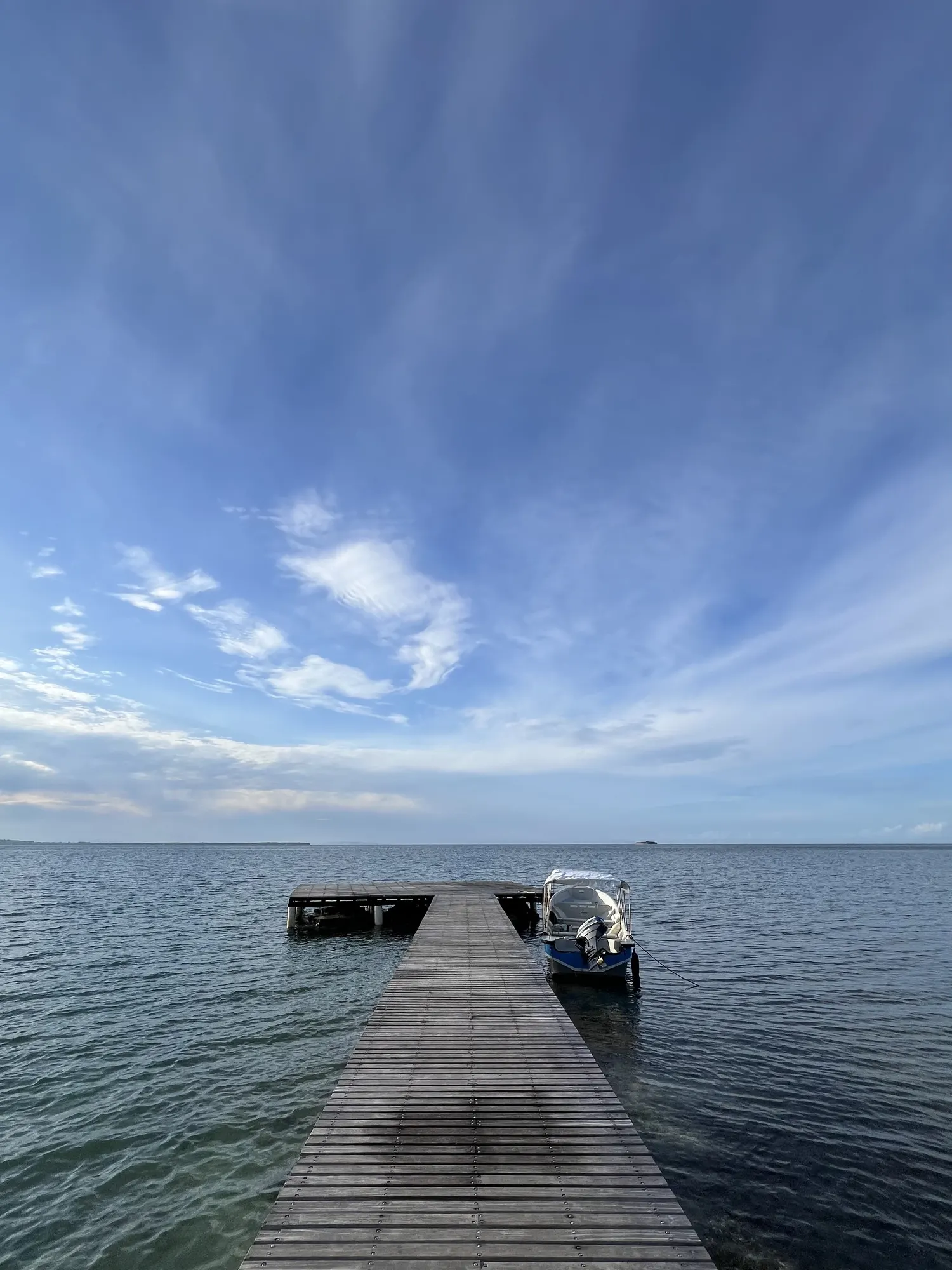 The pier under a wide sky