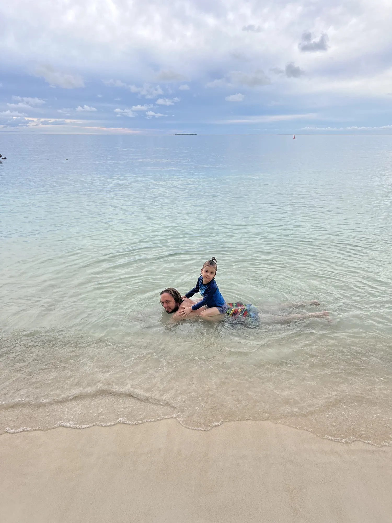 Mother and child in the shallows