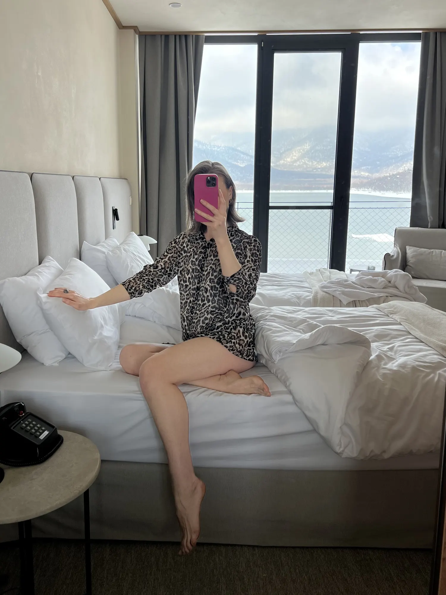 A mirror selfie on the bed