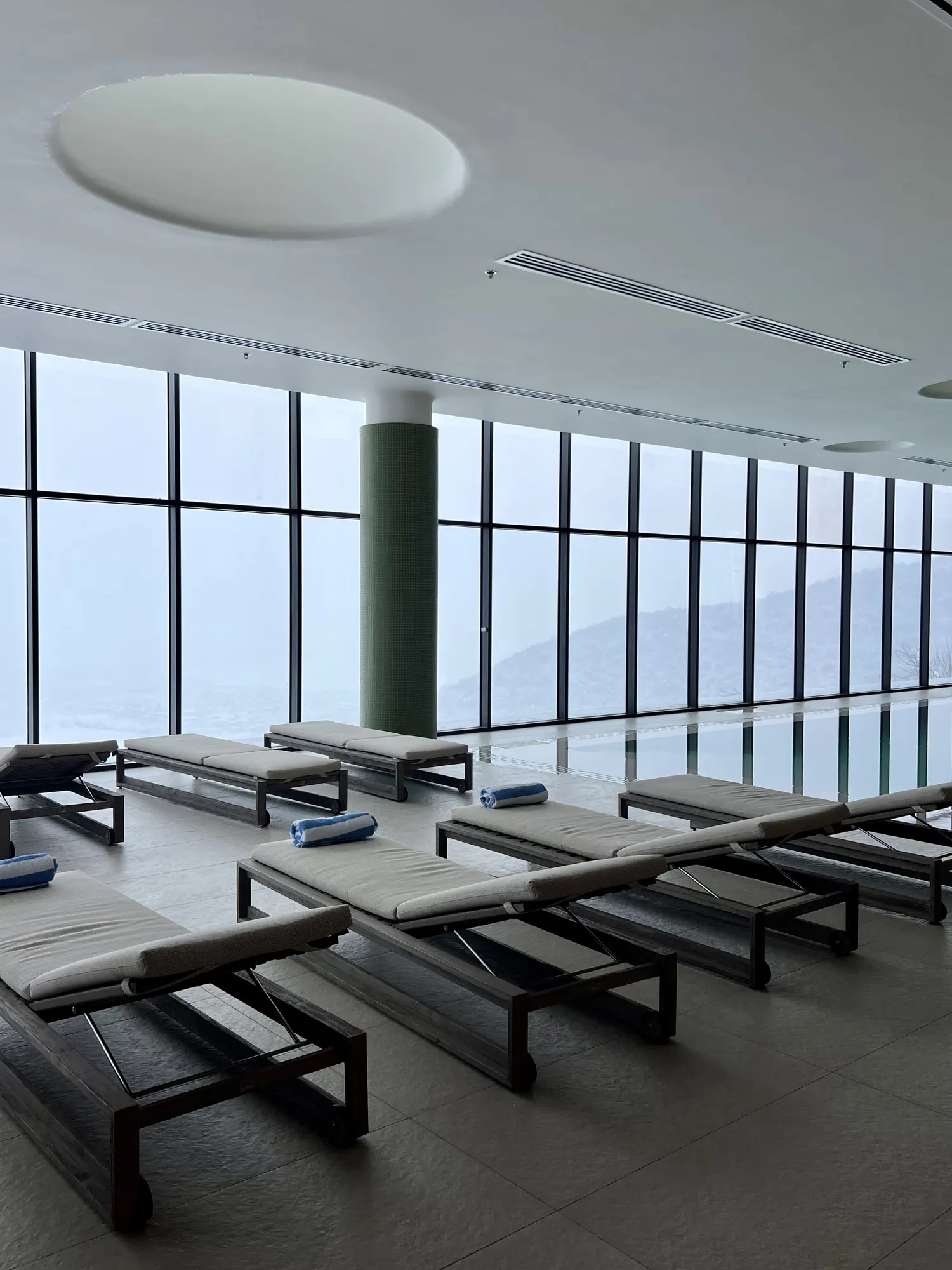 Loungers along the glass wall